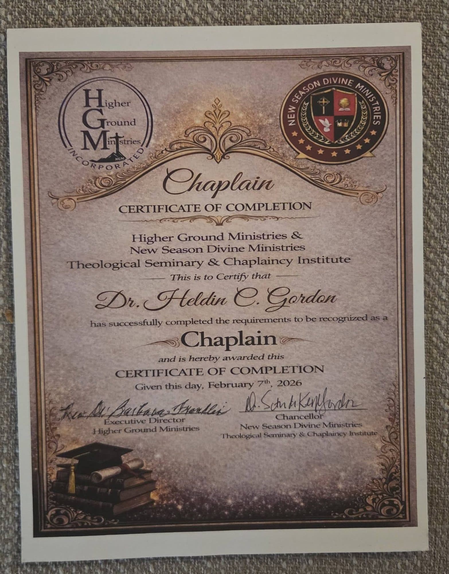 A chaplain certificate of completion from Higher Ground Ministries and the New Season Divine Ministries Theological Seminary & Chaplaincy Institute